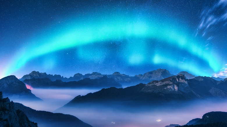 Blue aurora above a mountainscape