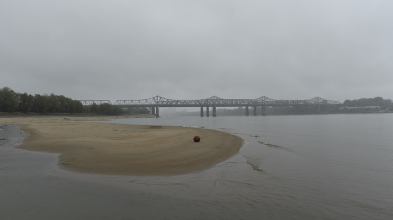 Mississippi River shallows with bridge in background