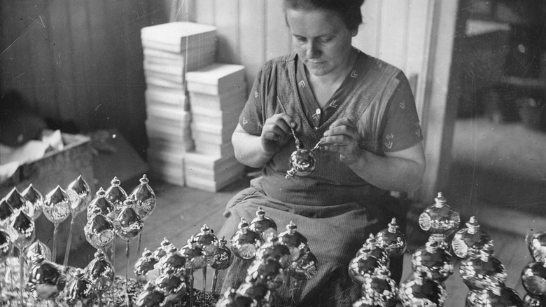 woman handmaking christmas ornaments 1935