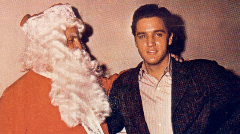 Elvis with Tom Parker as Santa