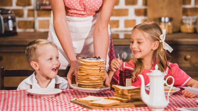 1950s era kids getting served breakfast