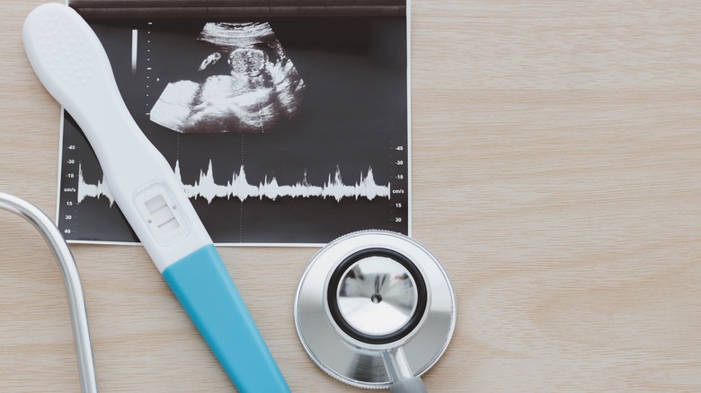 Pregnancy test and stethoscope