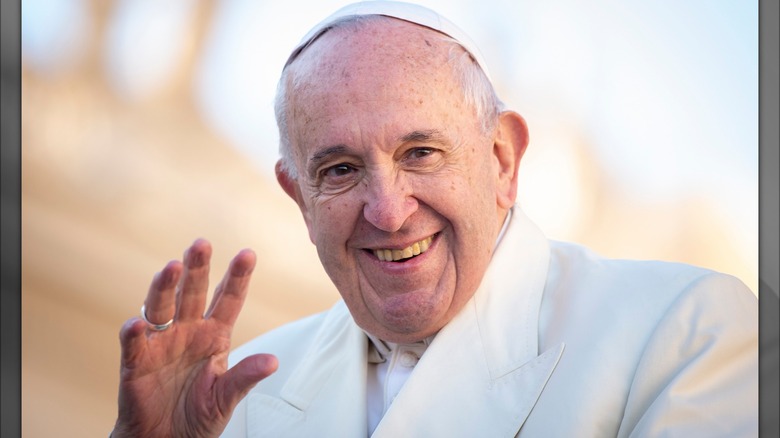 Pope Francis waving and smiling