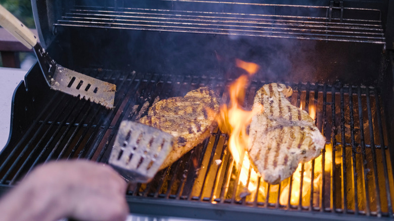 Two swordfish steaks being barbecued