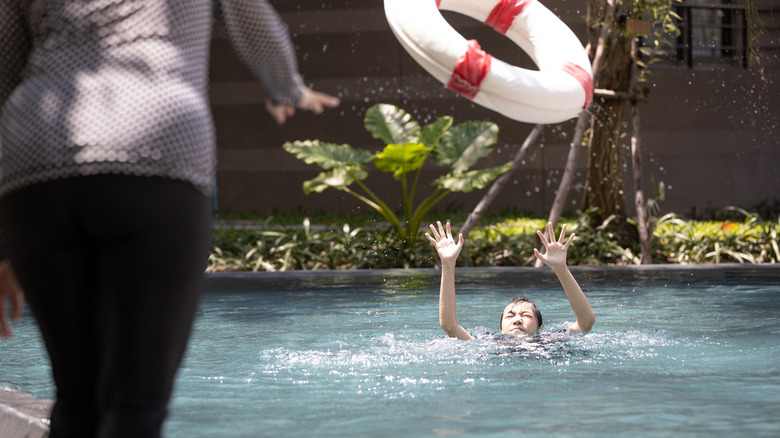 Woman throwing life preserver