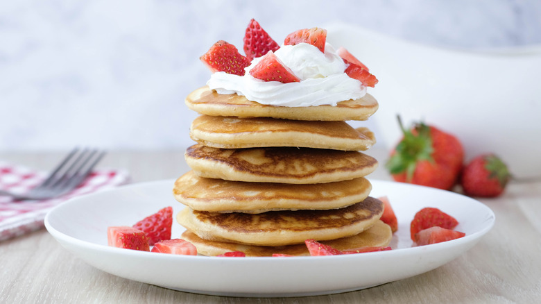 Pancakes with whipped cream and fruit