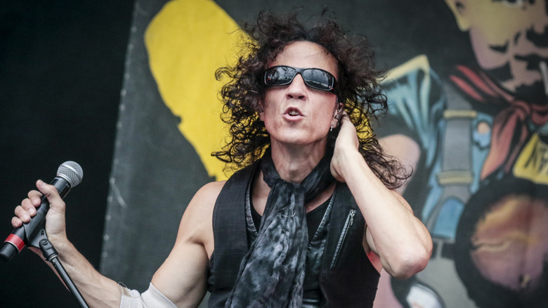 Gary Cherone sunglasses long hair performing live