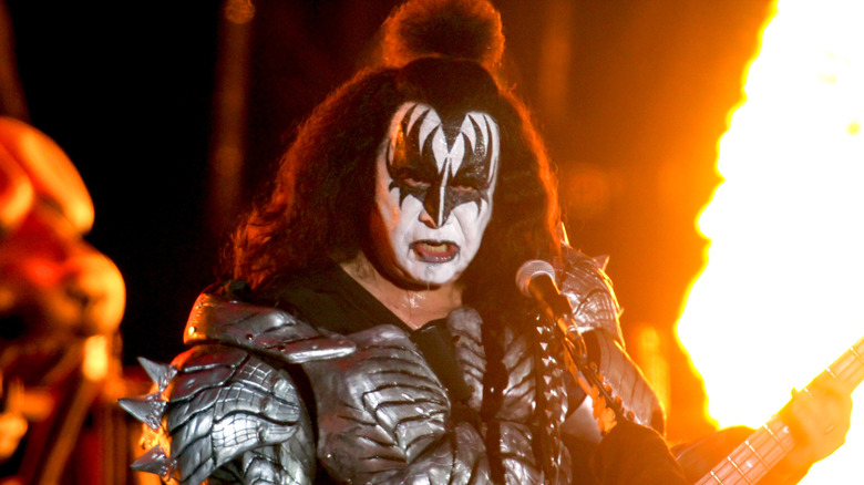 Gene Simmons KISS face paint performing flames