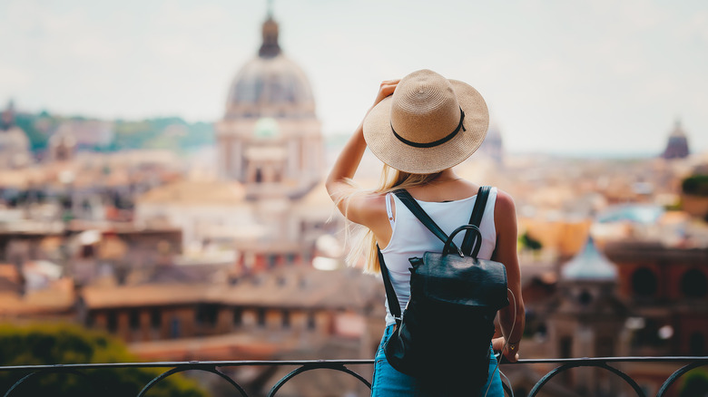 a tourist overlooking rome