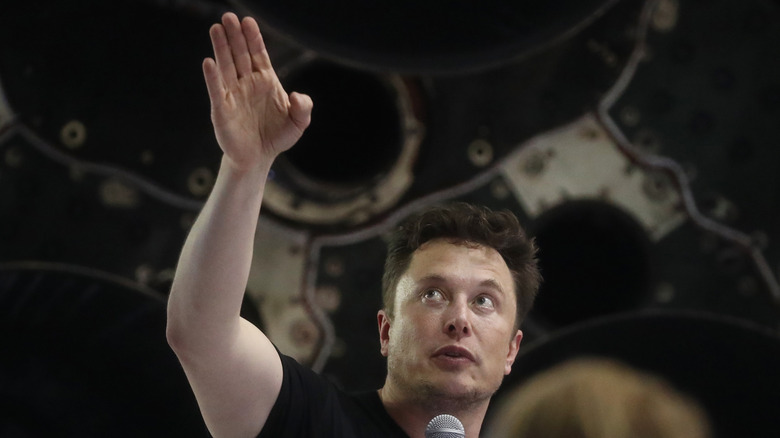 Elon Musk pointing to the sky