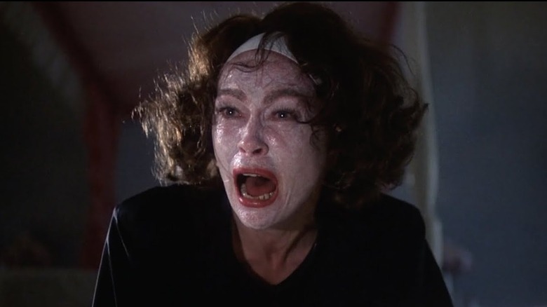 Faye Dunaway in makeup screaming