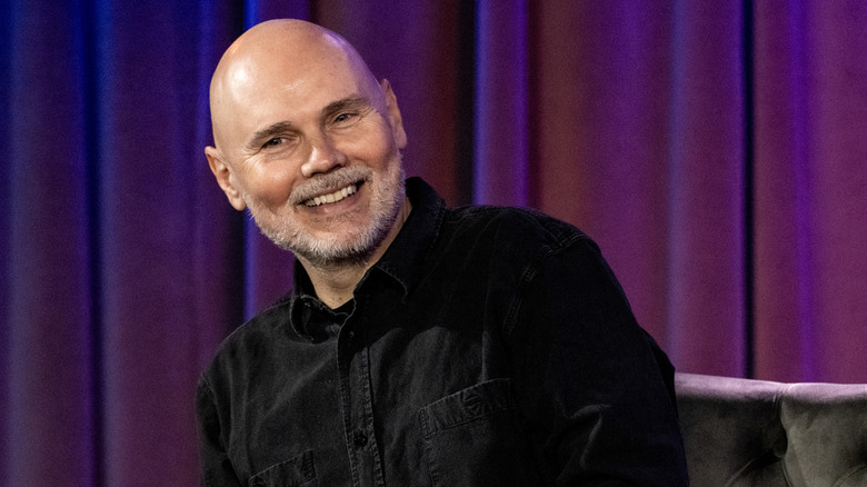 Billy Corgan smiling while speaking at 2023 event