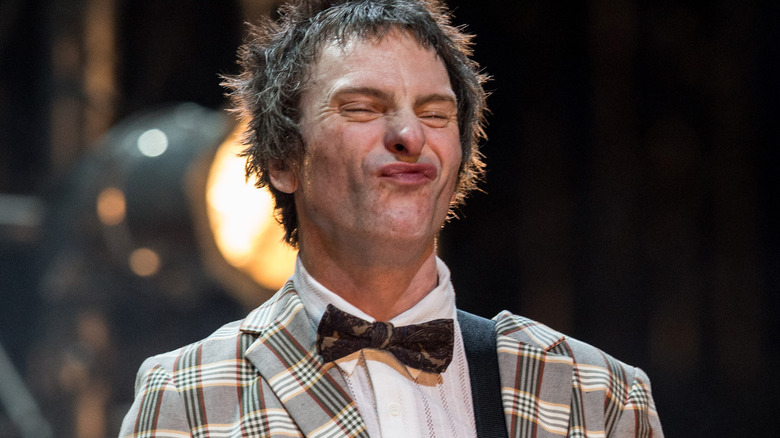 Tommy Stinson in plaid jacket and bow tie 