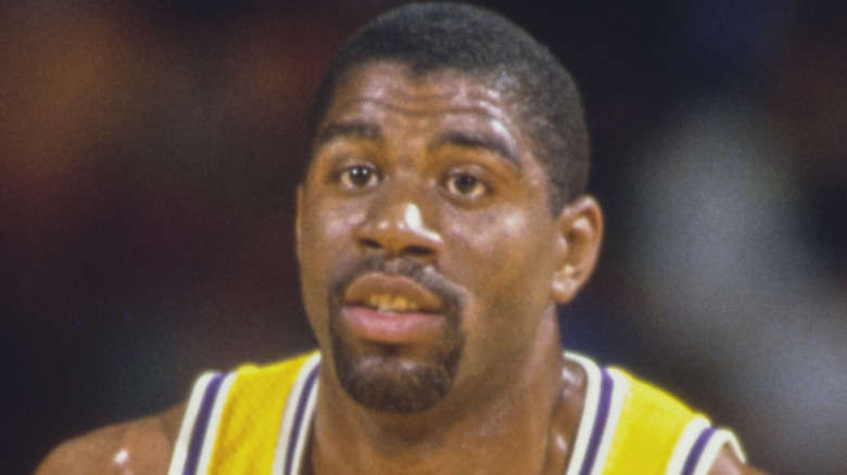 Magic Johnson running down the court for the Lakers