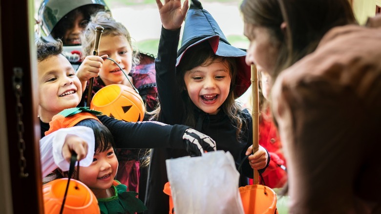 Children in costumes trick-or-treating