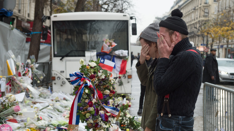 Jesse Hughes cries in front of Paris attack memorial