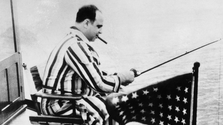 Al Capone fishes in bathrobe