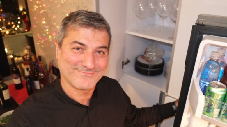 Paolo Macchiarini opening refrigerator