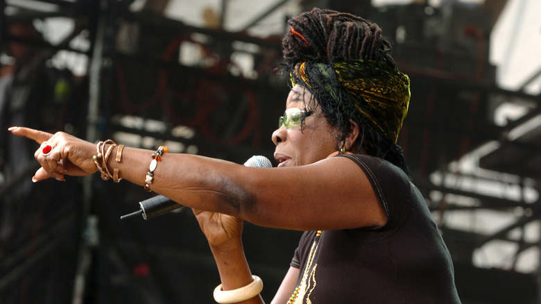 Rita Marley points speaking into microphone