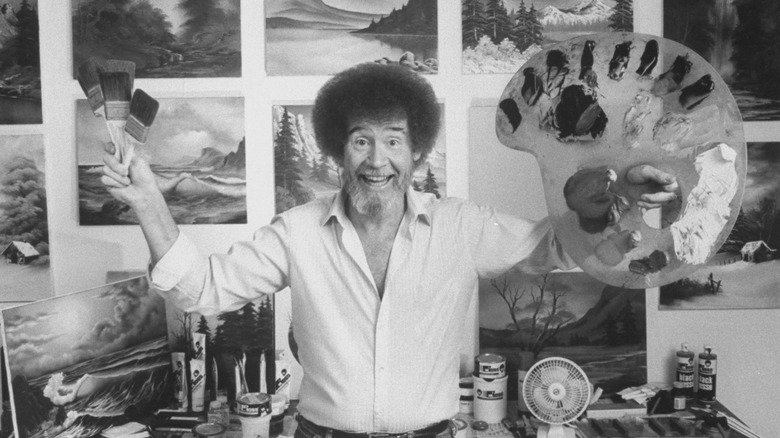 Bob Ross holding paint brush