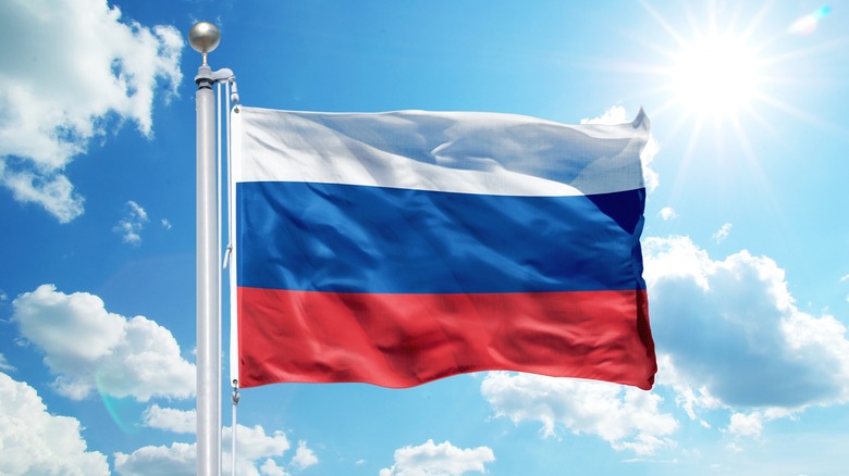 Russian flag against blue sky