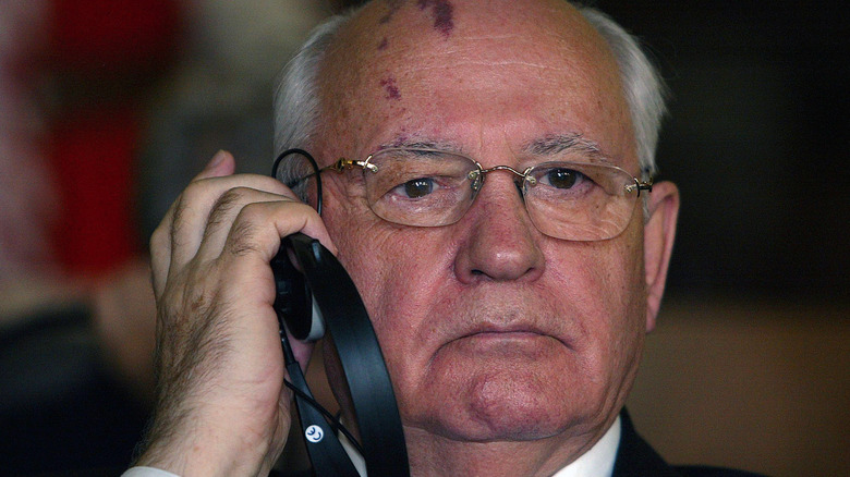 Mikhail Gorbachev listens to headphones