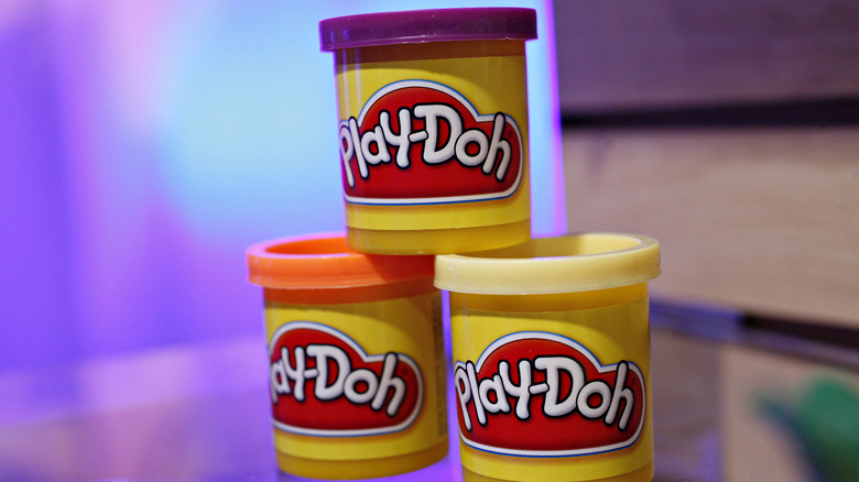 Three cans of Play-Doh