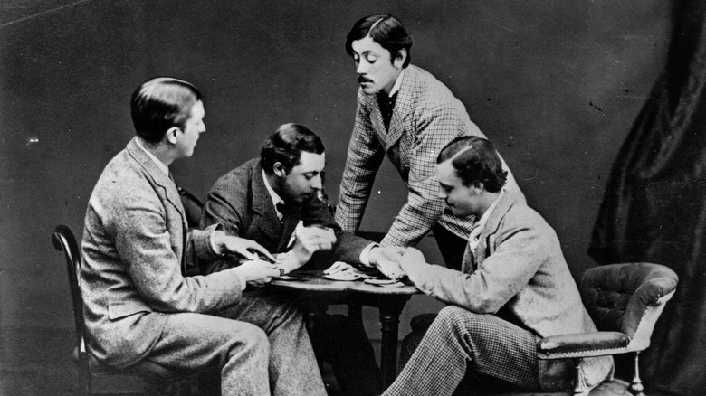 Prince Leopold and college friends posing as if playing cards