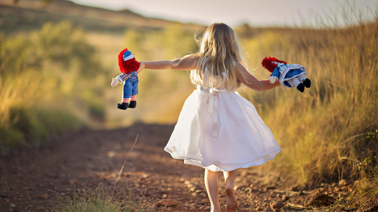 Child with Raggedy Ann and Andy