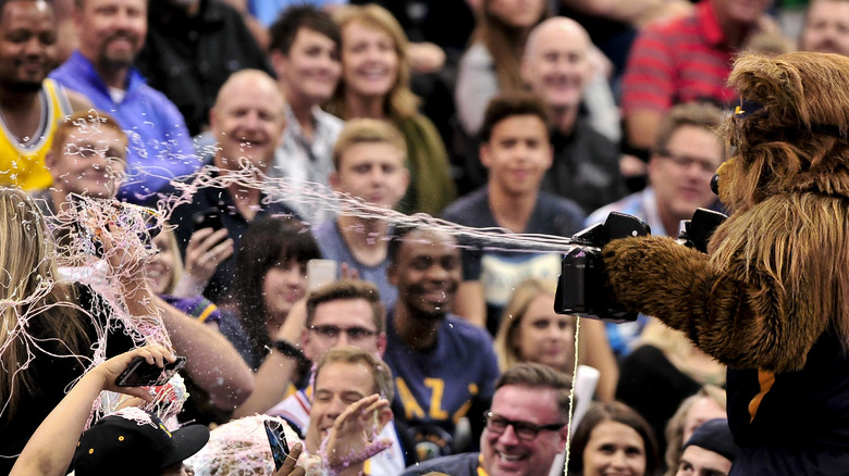 sports mascot sprays fans with silly string