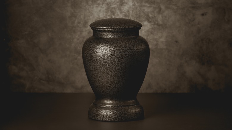 funeral urn beige background