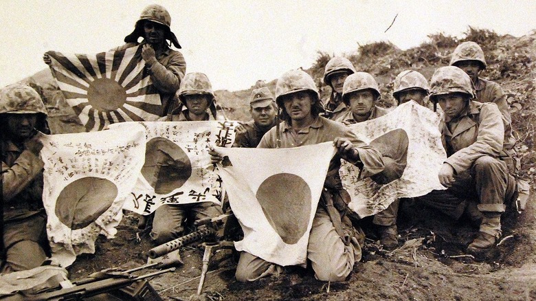 U.S. soldiers brandishing war trophies