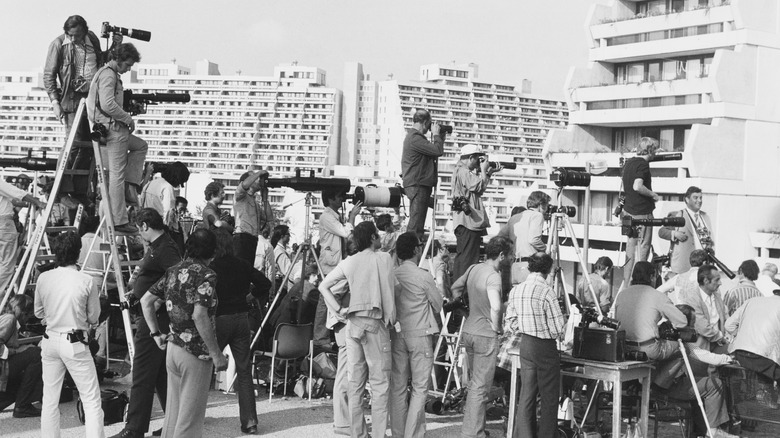 reporters at olympic village