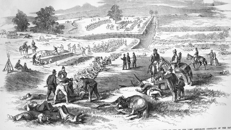 Engraving of Antietam soldiers being buried