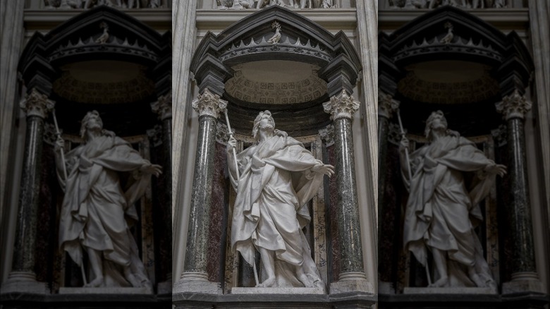 Stone statue of St. James the Great with staff