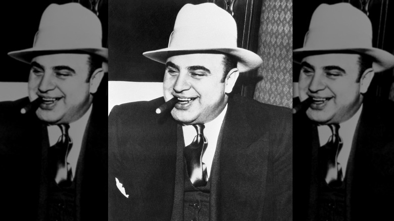 AL Capone smiling hat cigar in mouth