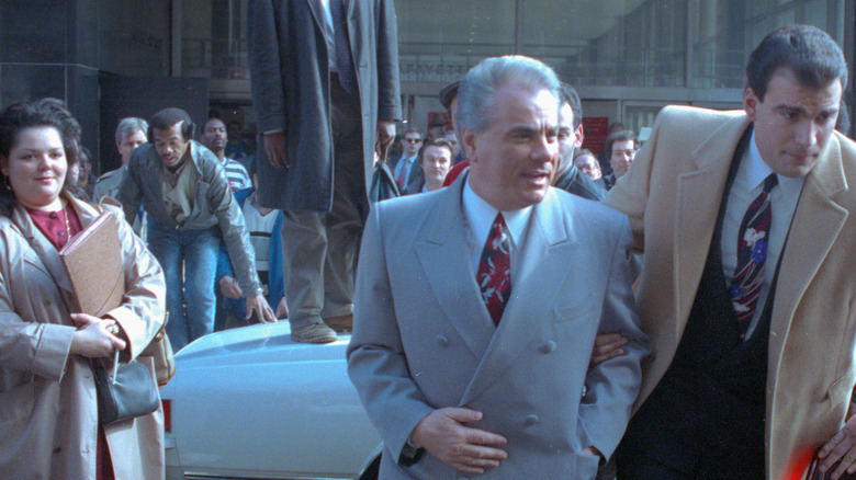 John Gotti walking grey jacket in crowd