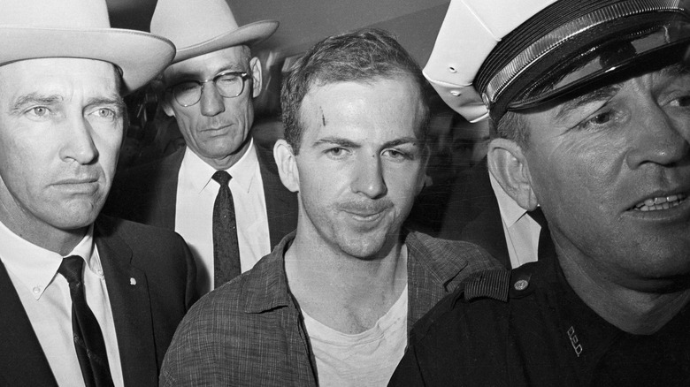 Lee Harvey Oswald escorted by police