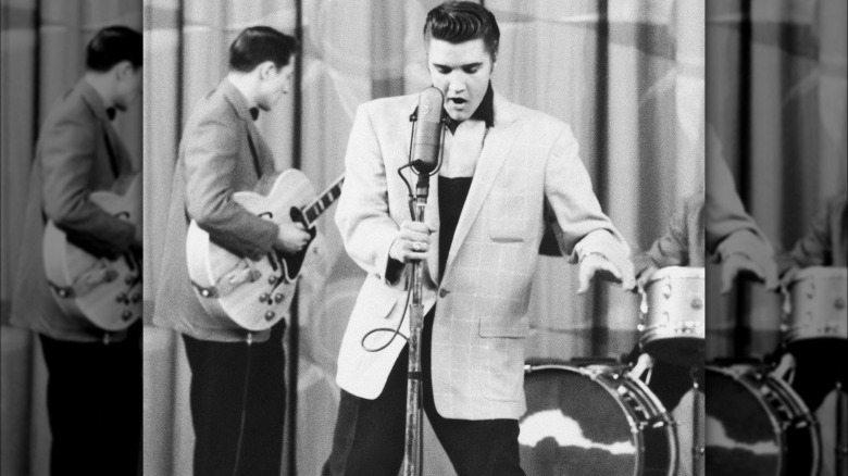 Elvis Presley dancing and singing