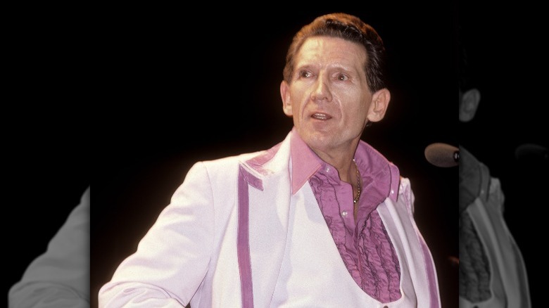 Jerry Lee Lewis onstage pink white suit