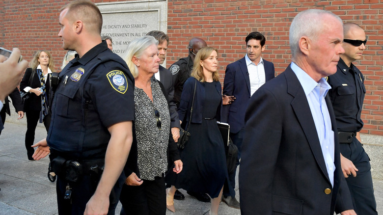 Felicity Huffman (center) leaving courthouse