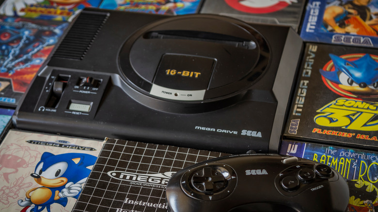 Sega Genesis, controller, and game boxes