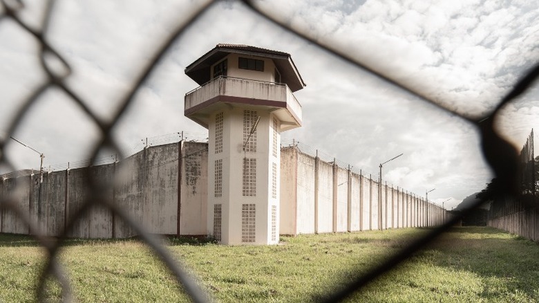 prison behind a fence