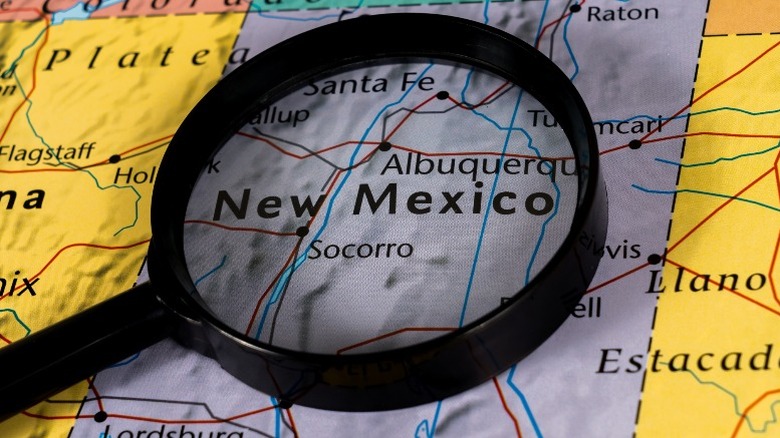 magnifying glass on a map of new mexico