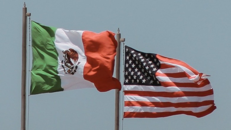 US and Mexican flags at the border crossing