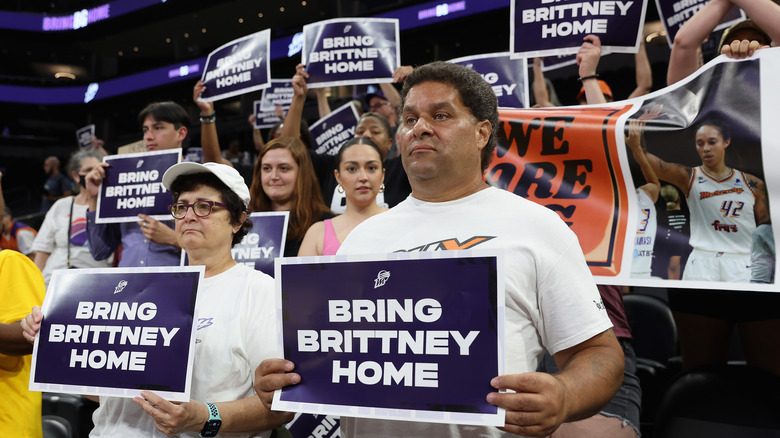 Fans holding Bring Brittney Home signs