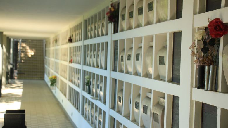 Urns in columbarium wall