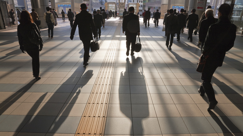 Tokyo businesspeople leaving train station