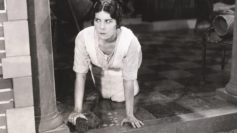 woman scrubbing the floor