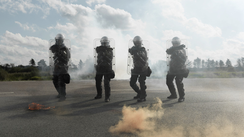 Riot cops holding shields